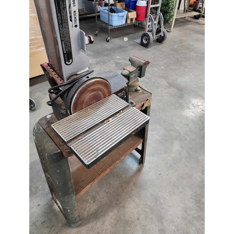 Bench vice mounted on a cart with damaged sander. A-9